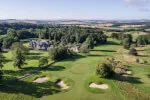 Golf course at Roxburghe Hotel Golf & Spa with large house, sand bunkers, and scenic landscape