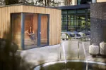 Woman sitting in aroma sauna with larch wood at Roxburghe Hotel Golf & Spa's SCHLOSS Spa, choosing from three fragrances