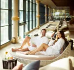 A couple enjoying a relaxing moment in comfort, highlighting the spa amenities at 12.18. Roxburghe Hotel Golf & Spa Ltd.