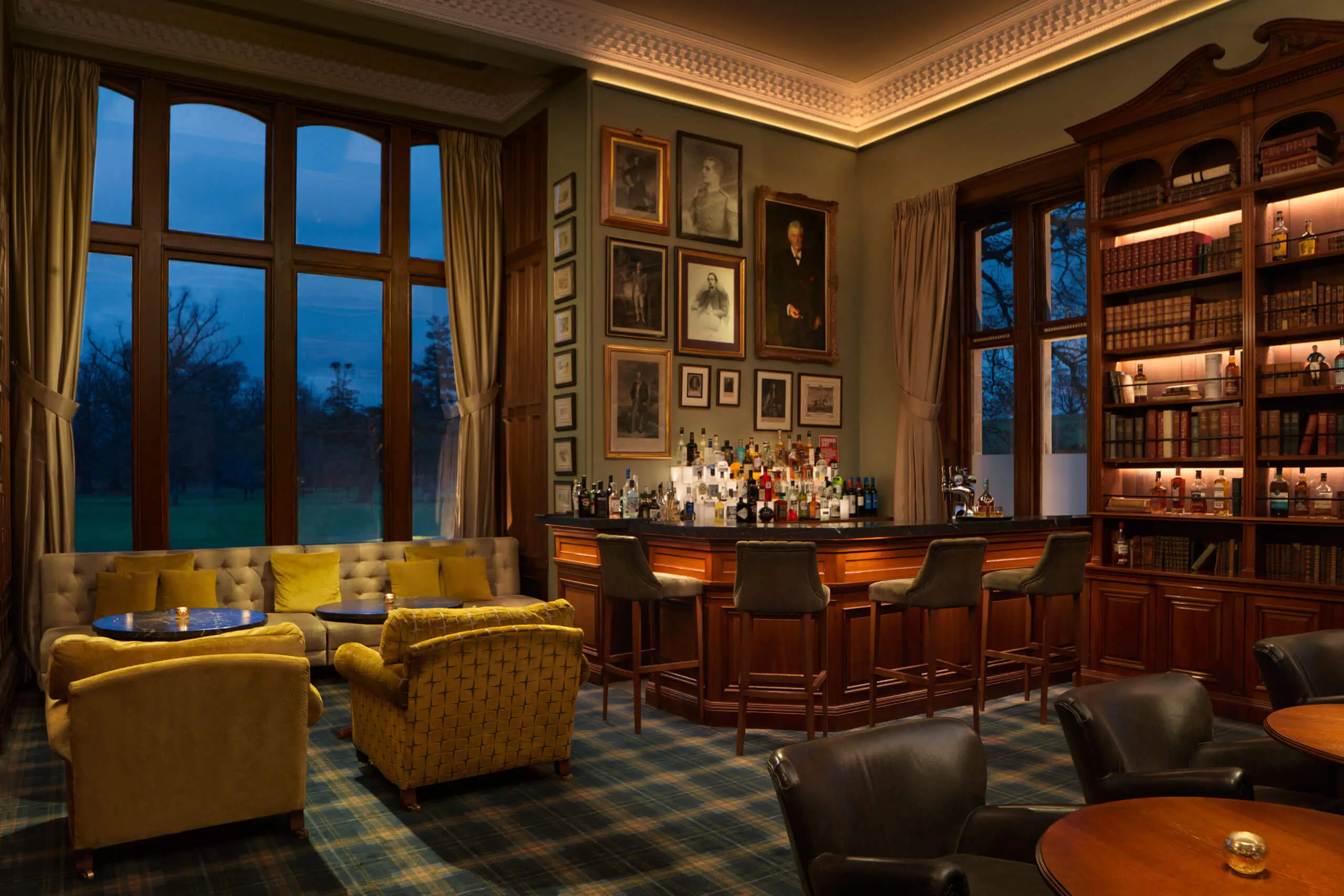 Elegant bar area with plush seating and a vast selection of drinks at Roxburghe Hotel Golf & Spa.