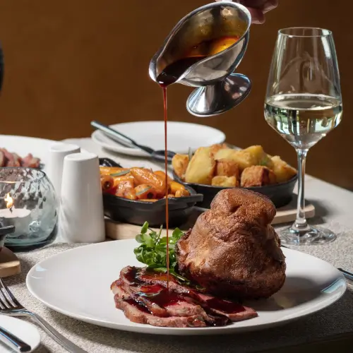 Gourmet meal with sliced meat and Yorkshire pudding served at Roxburghe Hotel Golf & Spa.