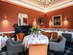 Elegant dining room at Roxburghe Hotel featuring stylish furnishings and decor.