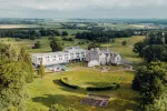 Aerial view of the Roxburghe Hotel Golf & Spa, surrounded by lush green landscapes.