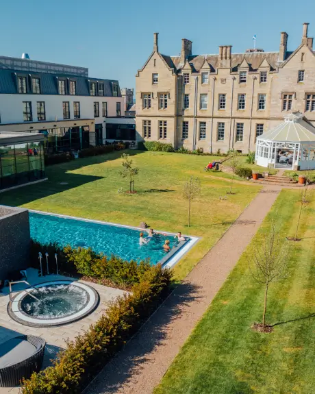 Outdoor pool and garden at Roxburghe Hotel Golf & Spa Ltd., a perfect spot for relaxation.