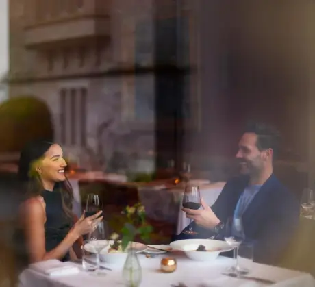 A couple enjoying a romantic dinner at Roxburghe Hotel Golf & Spa Ltd.