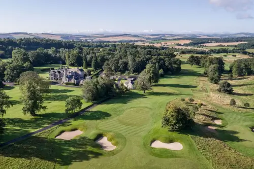 Aerial view of Roxburghe Hotel Golf & Spa, showcasing the lush golf course and beautiful surroundings.