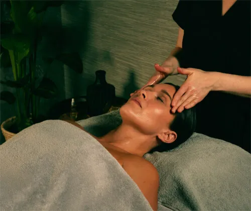 Relaxing facial massage at Roxburghe Hotel Golf & Spa, providing rejuvenating spa experience.