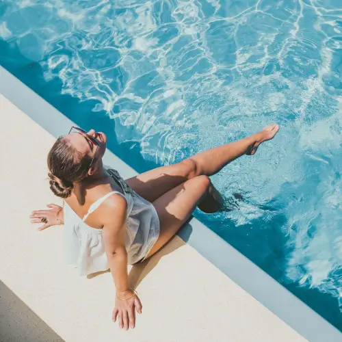 Woman relaxing by the pool at Roxburghe Hotel Golf & Spa Ltd.