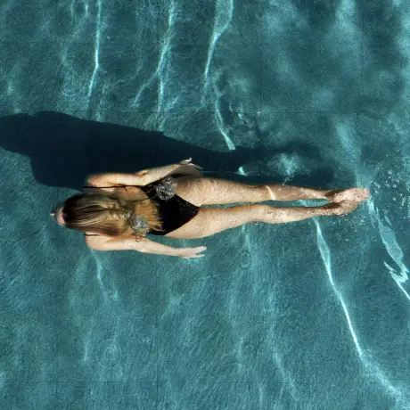 Woman swimming in a pool at Roxburghe Hotel Golf & Spa Ltd.